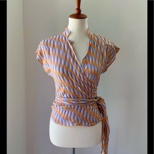 Beautiful DVF 100% silk short sleeve wrap blouse in fun orange/white/blue print